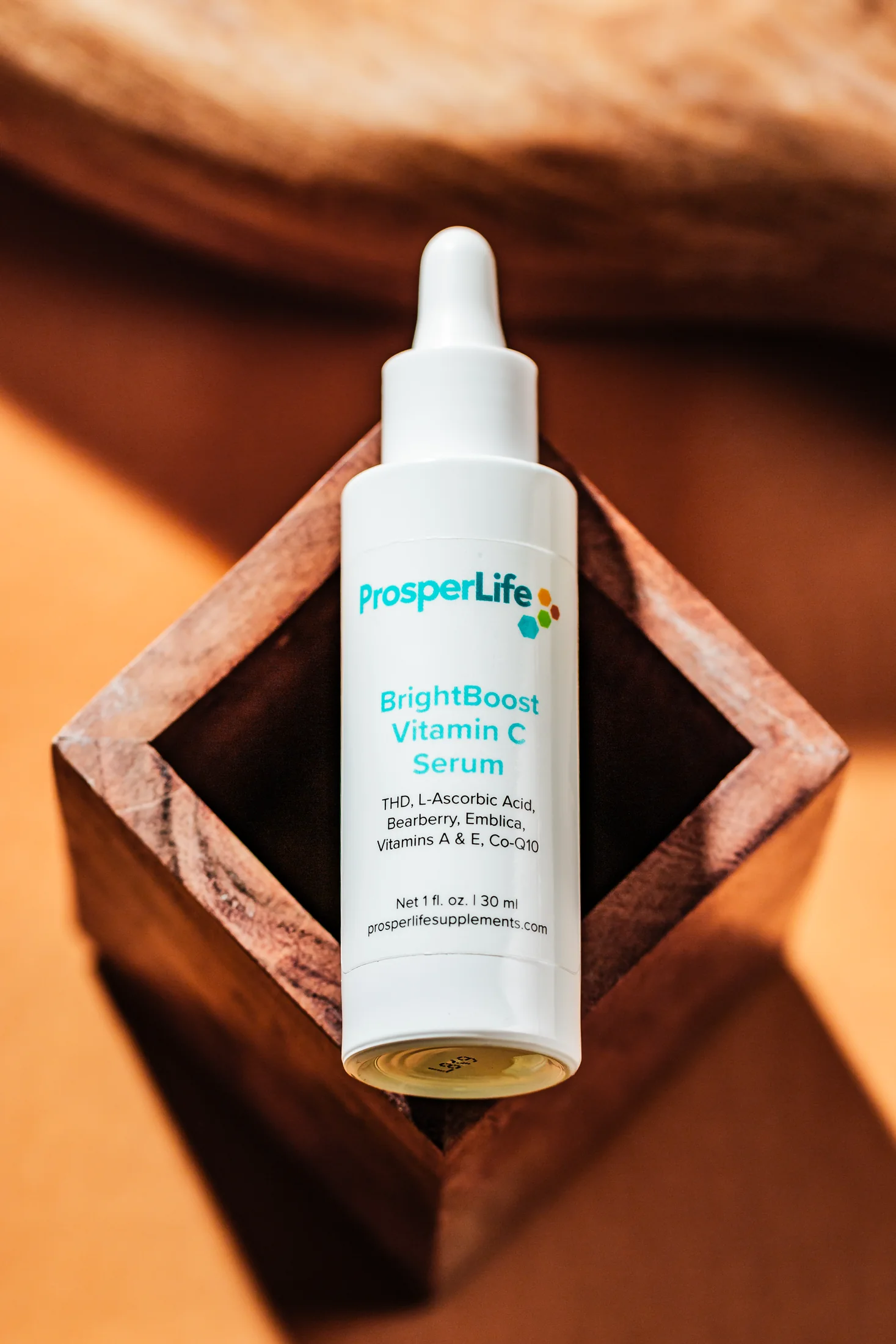ProsperLife BrightBoost Vitamin C Serum in the original brand studio
