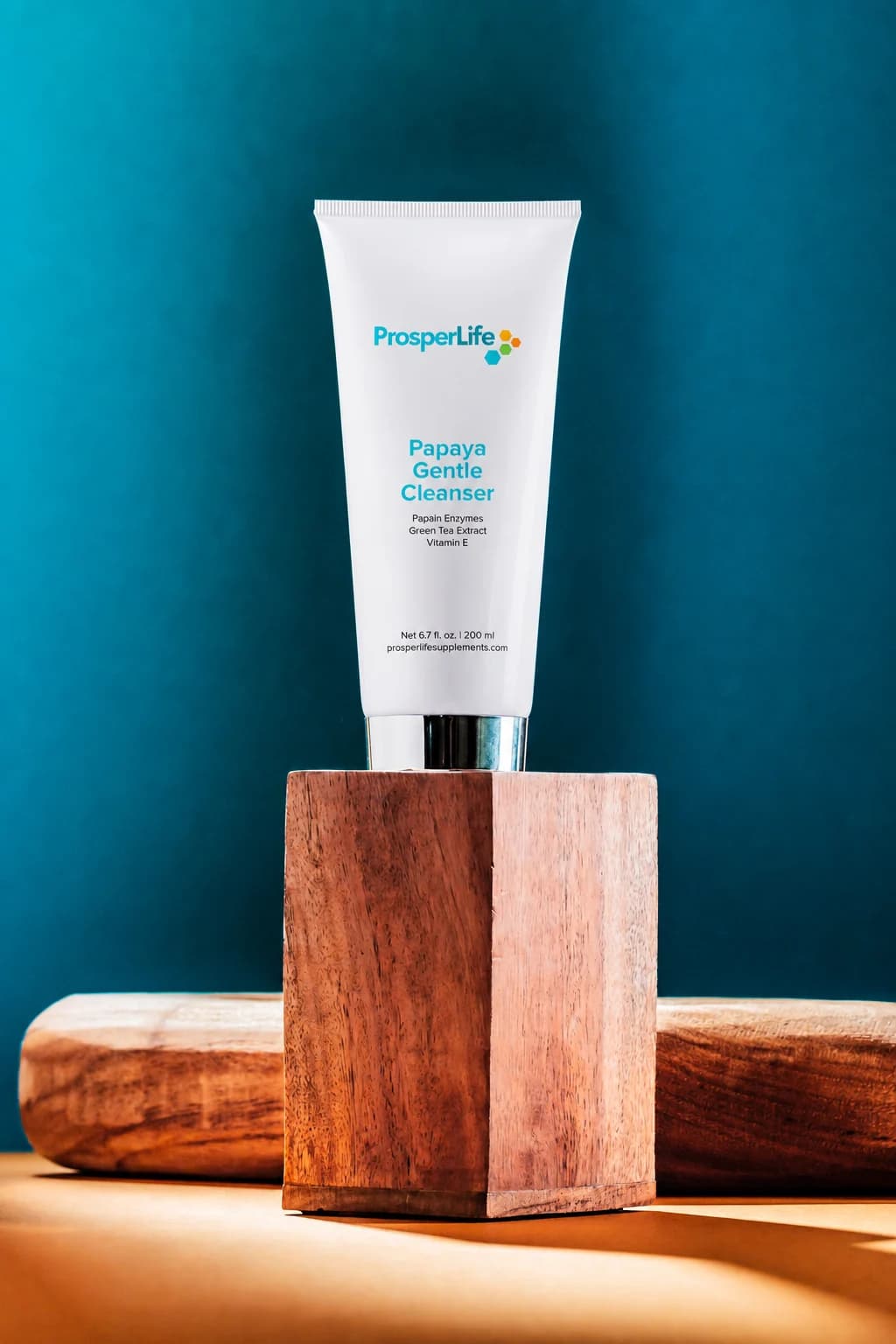 Current ProsperLife Papaya Gentle Cleanser in an original ProsperLife studio set